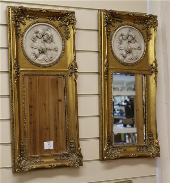 A pair of gilt mirrors with resin plaques W.31cm